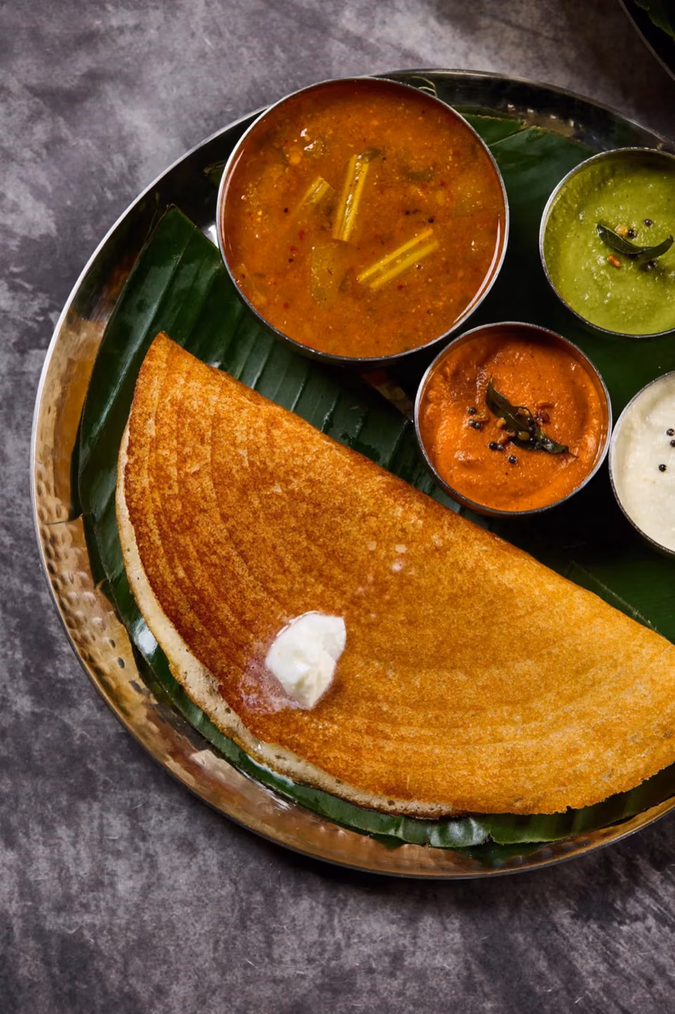 Crispy benne dosa with sambar and chutneys