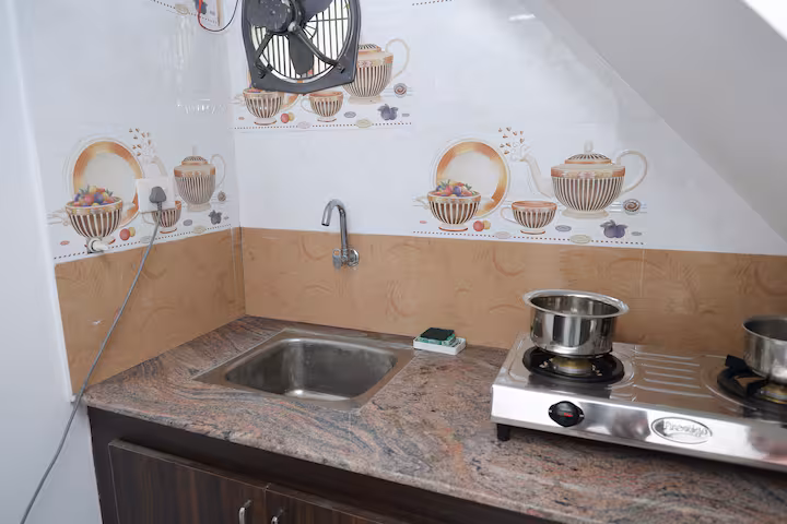 Shared kitchenette at Nivaa Stays